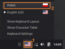 Zrzut ekranu pokazujący wybranie polskiej flagi z dolnego paska Cinnamona